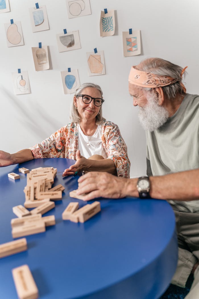 Elderly Couple Playing Game Together